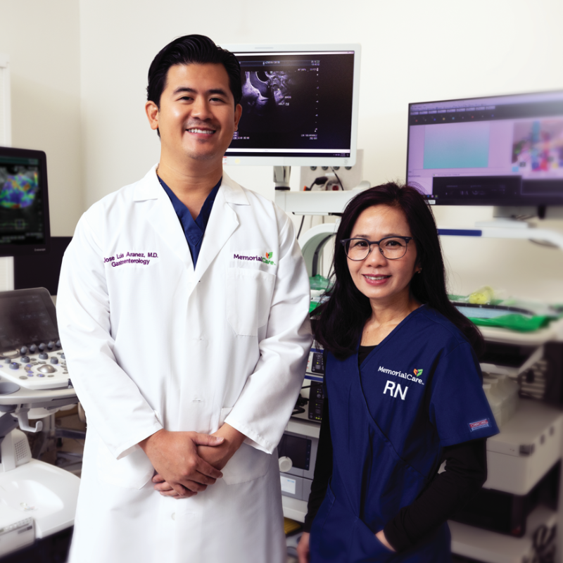 Dr. Jose Luis Aranez and nurse navigator Xuan Tram stand in front of endoscopic ultrasound technology. 