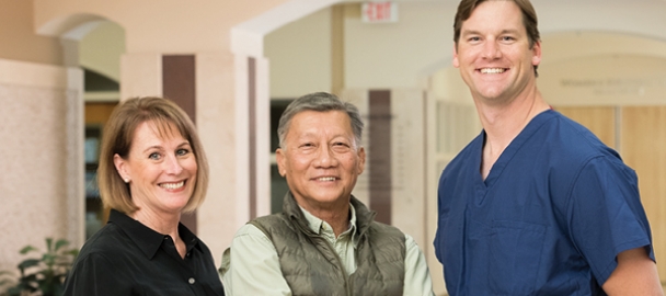 Image of Bihn Pham, his wife and doctor. Bihn was treated at the Center for Spine Health at MemorialCare Saddleback Medical Center.