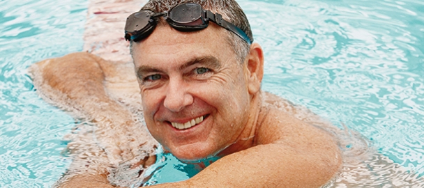 Image of happy man in a swimming pool